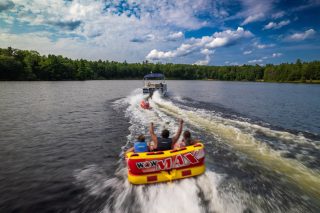 Rafting Drone picture of a boat pulling a raft
